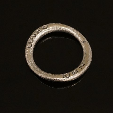 Charlotte Lynggaard, Copenhagen: A 18kt whitegold 
"Love"-ring. Ringsize: 52