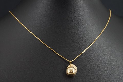 A 14k gold venezia necklace set with a cap pendant