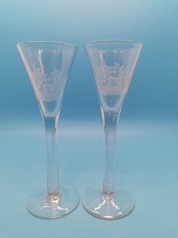 A pair of tall shot glasses with deer Kastrup Glasværk