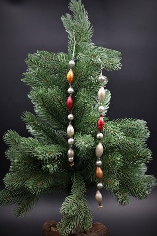 Old Christmas decorations for the Christmas tree, small colored glass balls on 
string.
L: 30cm. & 22cm.