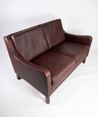 Two seater sofa, with red brown leather by Stouby Furniture.
5000m2 showroom.
