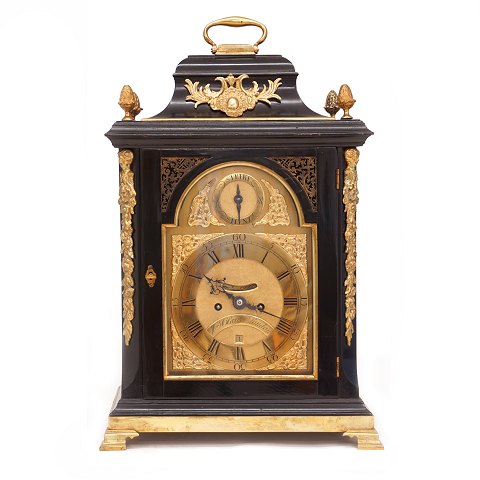 A large black laquered Geroge III bracket clock by 
William Clarke, London, circa 1760. H: 58cm. W: 
38cm. D: 24cm