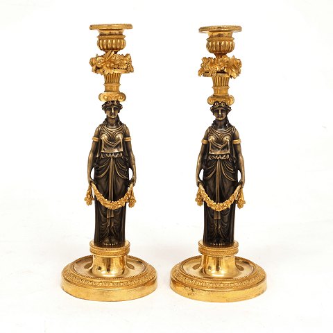 A pair of late 18th century fire gilt  bronze 
candelsticks. Paris circa 1780. H: 31cm