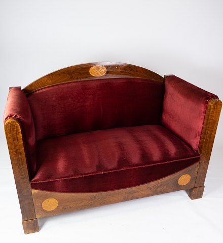 Two seater sofa of walnut with inlaid wood and upholstered with red velvet from 
around 1910.
5000m2 showroom.