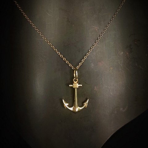 A necklace set with pendant i shape of anchor, mounted in 14k gold