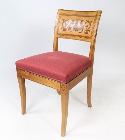 Dining room chair of light birchwood with inlaid wood and upholstered with red 
fabric from around 1810.
5000m2 showroom.