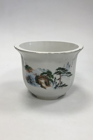 Porcelain flower pot / flower pot cover made in China. With landscape motif and 
gold edge