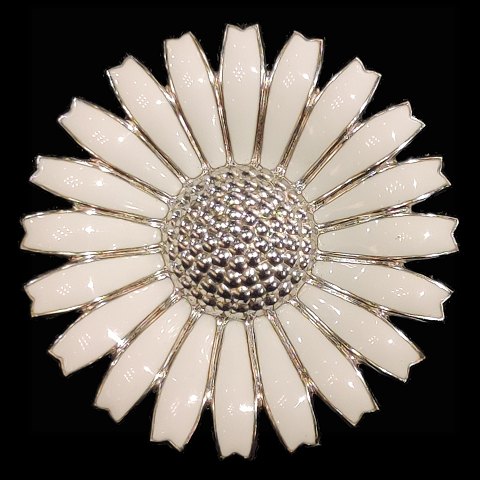 Georg Jensen; A Daisy brooch of sterling silver with white enamel