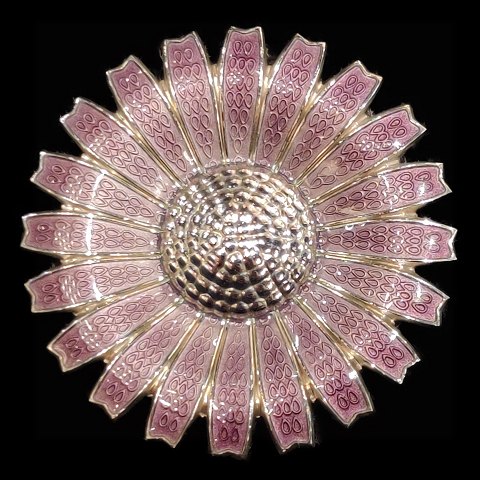 Georg Jensen; A Daisy brooch/pendant of sterling silver with purple enamel