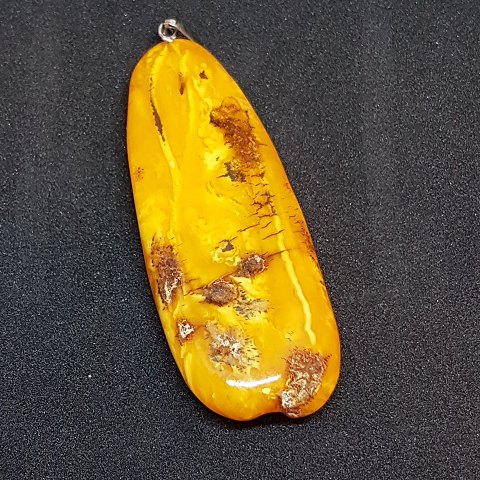 Butterscotch amber pendant with silver.