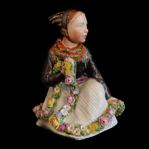 Royal Copenhagen, Carl Martin Hansen; A porcelain figurine of a Amager girl #12412