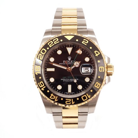 Rolex GMT Master II 18 kt gold and steel. Box and 
papers. Year 2014