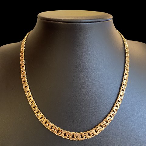 A necklace of 14k gold, l. 42,5 cm. w. 4-8 mm.
