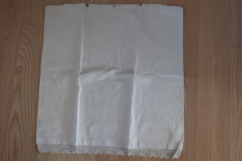 An antique pillow cover/pillow slip, big, with Signature
A beautiful old pillow cover with handmade white embroidery and with   old 
white buttons made of fabric
66cm x 63cm
The antique, Danish linen and fustian is our speciality