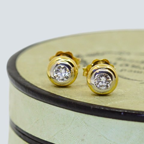 Earrings of 18k gold and white gold set with diamonds Earrings of 18k gold and white gold set with diamonds