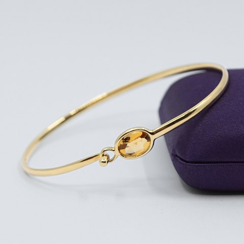 Georg Jensen; A Savannah bangle of 18k gold with a citrine Georg Jensen; A Savannah bangle of 18k gold with a citrine