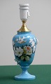 Turquoise 
opaline vase 
with flowers. 
Changed to 
electric lamp.
