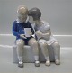 Bing and 
Grondahl B&G 
2175 Two 
children on 
bench 14 cm 
Marked with the 
three Royal 
Towers of ...