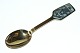 Christmas spoon 
1973 A. 
Michelsen
Solstice and 
family
Designed by Ib 
Spang Olsen
Gold ...