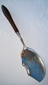 Antique fish 
serving spoon, 
silver handles 
of root wood, 
length 34cm. 
Stamped with 
maker's mark 
...