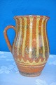 Milk jug 
pottery. Height 
15 cm. Fine 
condition.
