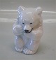 Royal 
Copenhagen 
Stoneware 235 
RC (1003 235)  
White bear cub 
sitting  Knud 
Kyhn 21435. In 
nice ...