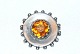 Silver brooch 
with 
orange-yellow 
stone
 Stamp: 828S 
BH
 Silversmith: 
B.H. 1893-1937 
B. ...