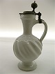A 18/19th 
century wine 
jug with pewter 
lid.  H.29 cm.