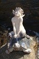 Royal 
Copenhagen 
porcelain. 
Royal 
Copenhagen 
figurine, Faun 
on tortoise no. 
858. Height 
9.5cm. 3 ...