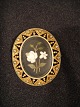 Brooch
 Gold 
Duplicate.
 Floral motif 
abolished in 
pietra dura 
style.
 surrounded 
with small ...