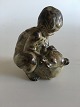 Royal Copenhagen Stoneware Figurine of a child with a bear No 20245