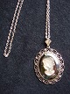 Presumably 
SWAROVSKI.
 Pendants with 
woman's head.
 Price Dkr. 
350, -