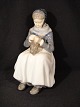 Figure.
 Amager Girl 
Height: 22.5 
cm.
 Royal 
Copenhagen. RC 
No.1317 2 
sorting
