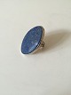 Bent Knudsen 
Sterling Silver 
ring wtih Blue 
Stone No 204. 
Ring Size can 
be adjusted. 
Measures ...