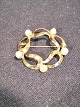 Brooch with 5 x 
4 mm beads.
 Gold 8k HS 
HS.Diameter Ø 
3.2 cm.
 polished and 
appears almost 
...