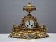 Old French 
Mantel clock 
made of gilded 
metal
Height 32 cm