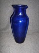 Blue Holmegaard 
vase.
 Height: 19.5 
cm.
 price Dkr. 
150, -