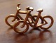 Georg Jensen 
Brass Pendent 
of bicycles No 
5214. Measures 
3.4 cm / 1 
11/32 in. and 
is in good ...