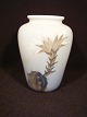 Vase with 
Christmas 
cactus.
 Height: 10.5 
cm
 Royal 
Copenhagen RC 
No. 2672-1740
 price Dkr. 
...