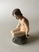 Royal 
Copenhagen 
Figurine Girl 
on Stone No 
4027. Measures 
15cm and is in 
good condition. 
...