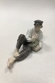Royal 
Copenhagen 
Figurine Boy at 
Lunch No 865. 
Measures 20 cm 
x 11 cm (7 7/8 
x 4 21/64 in) 
and ...