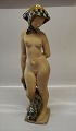 Copenhagen Art 
Pottery
by Helge 
Christophersen 
Nude woman with 
green glazed 
sharf 52 cm ...