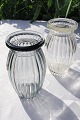 Holmegaard 
glassworks, 
circa 1939. 
Vases of 
pressed glass. 
1 vase clear 
glass, height 
11,7 cm. ...