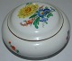 Meissen 
Porcelain 
Lidded Box with 
Flower Design. 
Measures 12cm 
and has a tiny 
chip on the 
inside ...