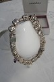 Pandora 
bracelet of 
sterling 
silver. 
Bracelet with 
pendant, see 
photo. Length 
21cm. Weight 74 
...