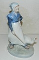 Porcelain 
figure of girl 
with goose from 
Royal 
Copenhagen. In 
perfect 
condition. 
First Sorting. 
...