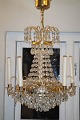Chandelier with 
3 interior 
bulbs and 5 
outer branches. 
Brass frame. 
Height 72 cm. 
Diameter 37 ...