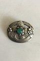 Georg Jensen 
sterling Silver 
brooch with 
green stone No 
138. Measures 4 
cm / 1 37/64 
in. Weighs ...