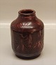 Royal 
Copenhagen 
Stoneware Vase 
Ox blood galze 
Jais Nielsen: 
Jonas and the 
whale 15 cm. In 
nice ...