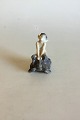 Royal 
Copenhagen 
Figurine faun 
on turtle No 
858. Measures 9 
cm / 3 35/64" 
and is in good 
condition.